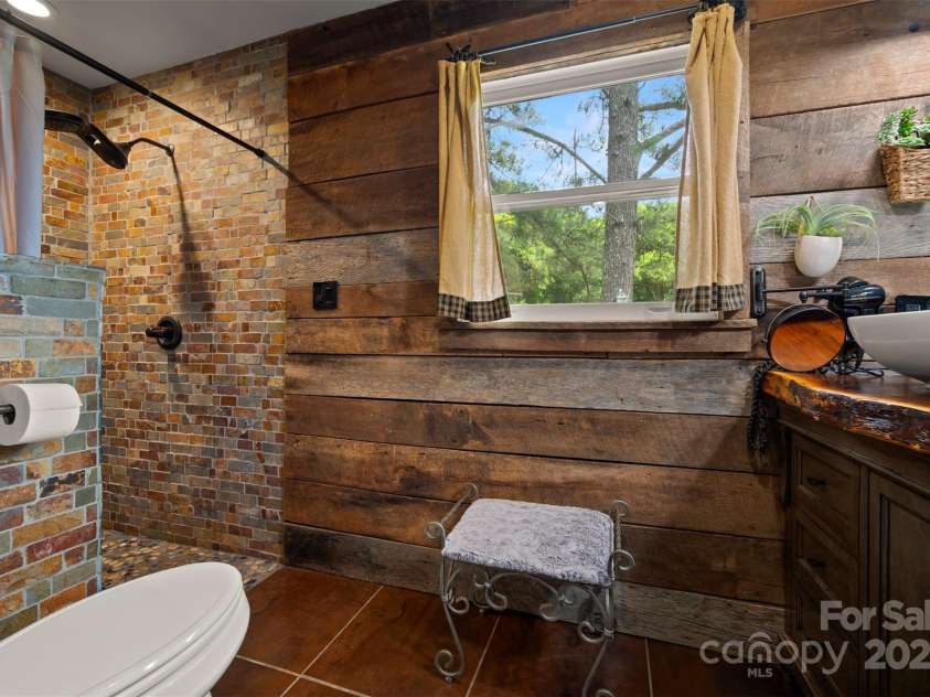 64 Persimmon Hill Drive, Columbus, NC 28722.  MLS# CAR4257157, YatesRealty ID 22038. Master walk-in shower