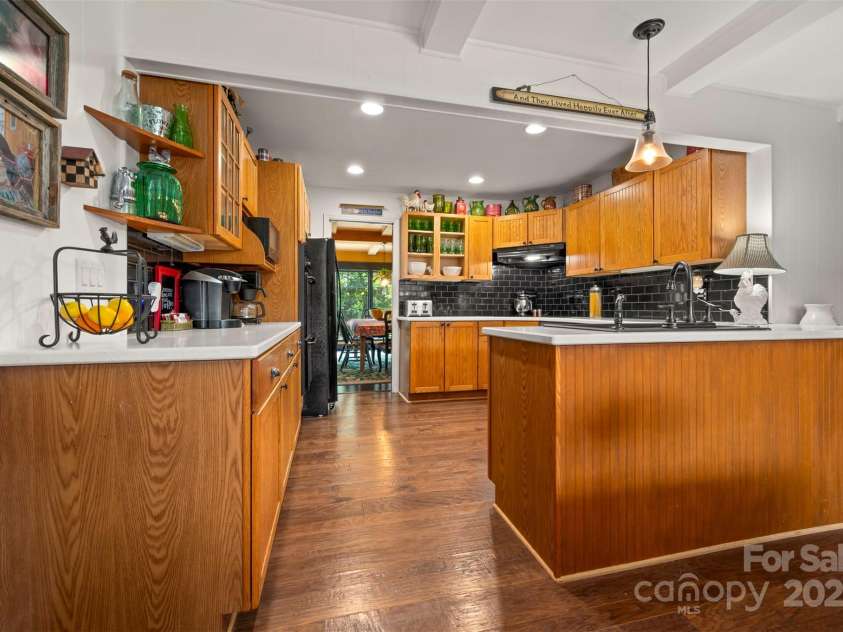 64 Persimmon Hill Drive, Columbus, NC 28722.  MLS# CAR4257157, YatesRealty ID 22038. Open Kitchen w/ solid surface countertops