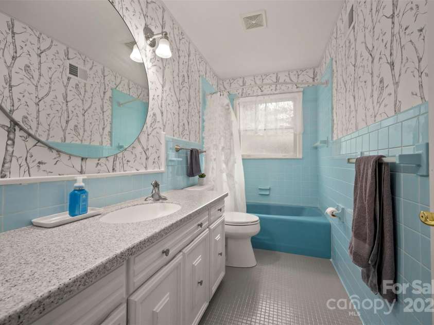 64 Persimmon Hill Drive, Columbus, NC 28722.  MLS# CAR4257157, YatesRealty ID 22038. Second Bathroom w/ solid surface counters & tile flooring