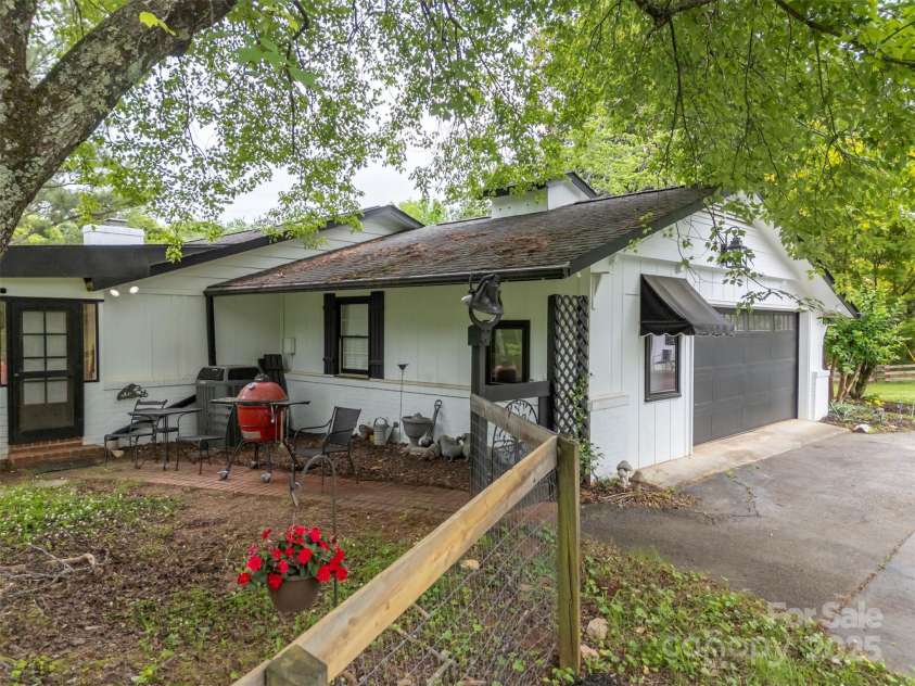 64 Persimmon Hill Drive, Columbus, NC 28722.  MLS# CAR4257157, YatesRealty ID 22038. Side view of house
