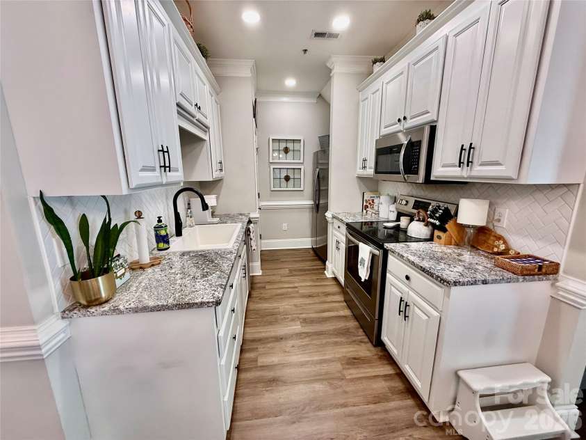 90 Huie Street, Concord, NC 28027.  MLS# CAR4379704, YatesRealty ID 22038. Kitchen area