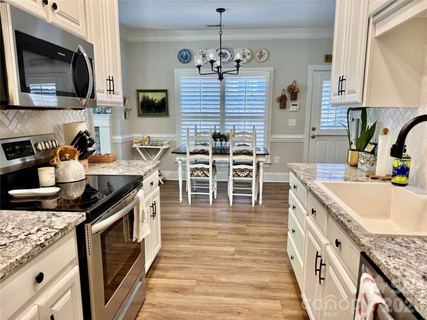 90 Huie Street, Concord, NC 28027.  MLS# CAR4379704, YatesRealty ID 22038. Kitchen open to dining area