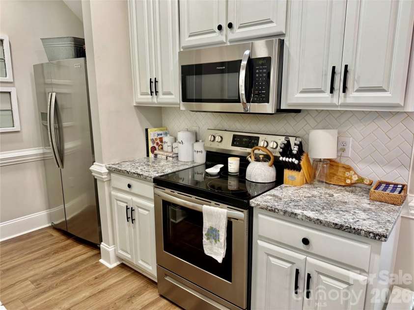 90 Huie Street, Concord, NC 28027.  MLS# CAR4379704, YatesRealty ID 22038. Lots of counter space, granite with tile backsplash