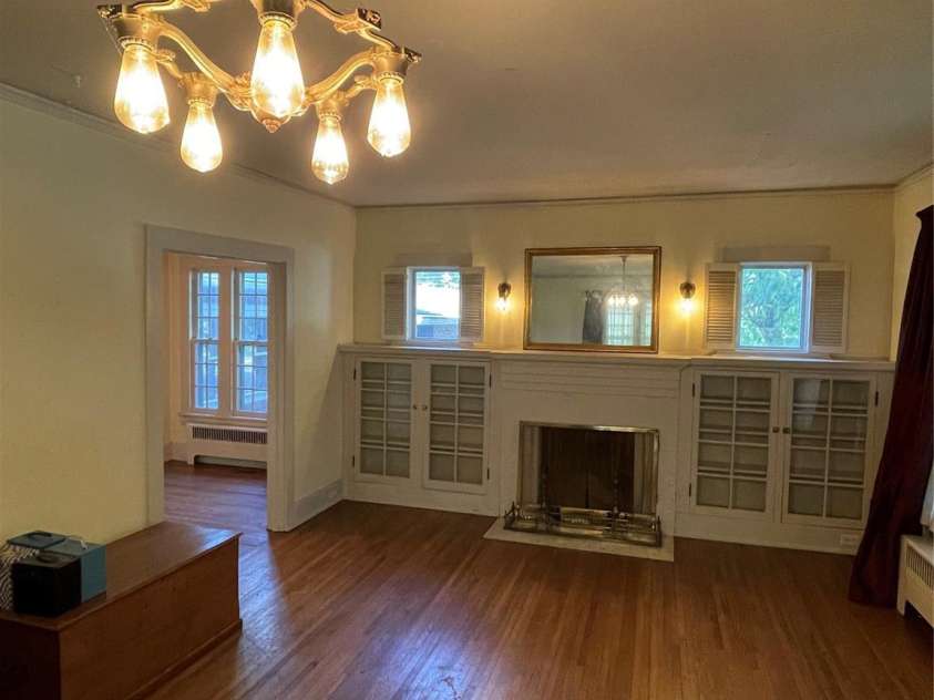 318 Academy Street, Canton, NC 28716.  MLS# CAR4263359, YatesRealty ID 2205. Built-ins flank the living room fireplace.