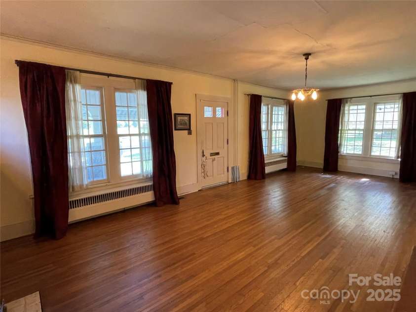 318 Academy Street, Canton, NC 28716.  MLS# CAR4263359, YatesRealty ID 2205. Vintage light fixtures remain in living and dining rooms