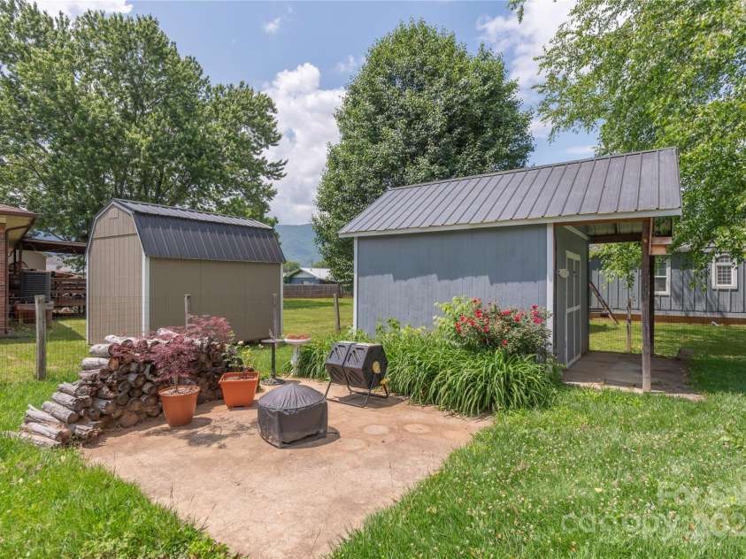 10 Poplar Street, Waynesville, NC 28786.  MLS# CAR4266866, YatesRealty ID 22051. Storage shed with electric