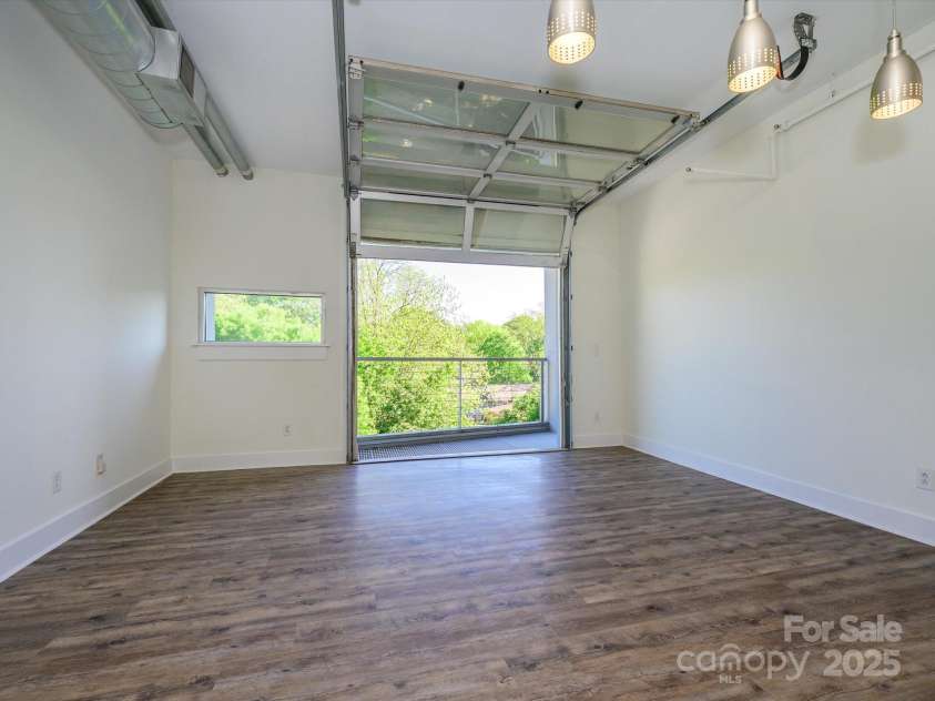 1611 Central Avenue, Charlotte, NC 28205.  MLS# CAR4250318, YatesRealty ID 22074. Cool garage door opening to balcony