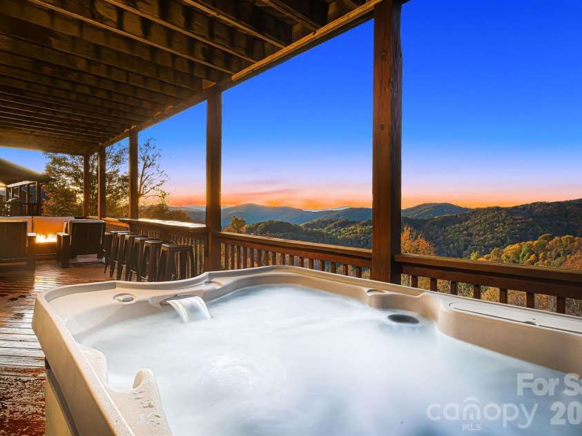 121 Scenic Wolf Drive, Mars Hill, NC 28754.  MLS# CAR4372121, YatesRealty ID 22080. Hot tub with spectacular views