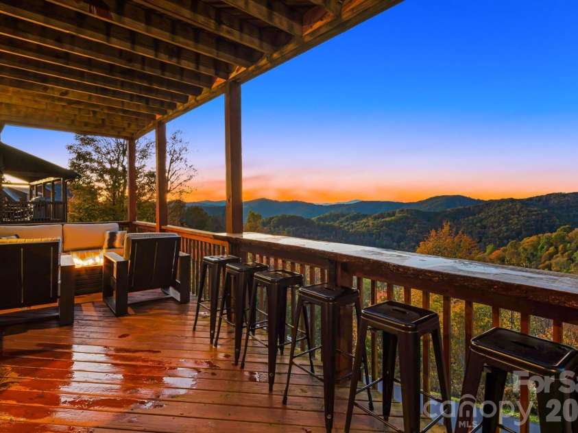 121 Scenic Wolf Drive, Mars Hill, NC 28754.  MLS# CAR4372121, YatesRealty ID 22080. Lower level deck w/ views
