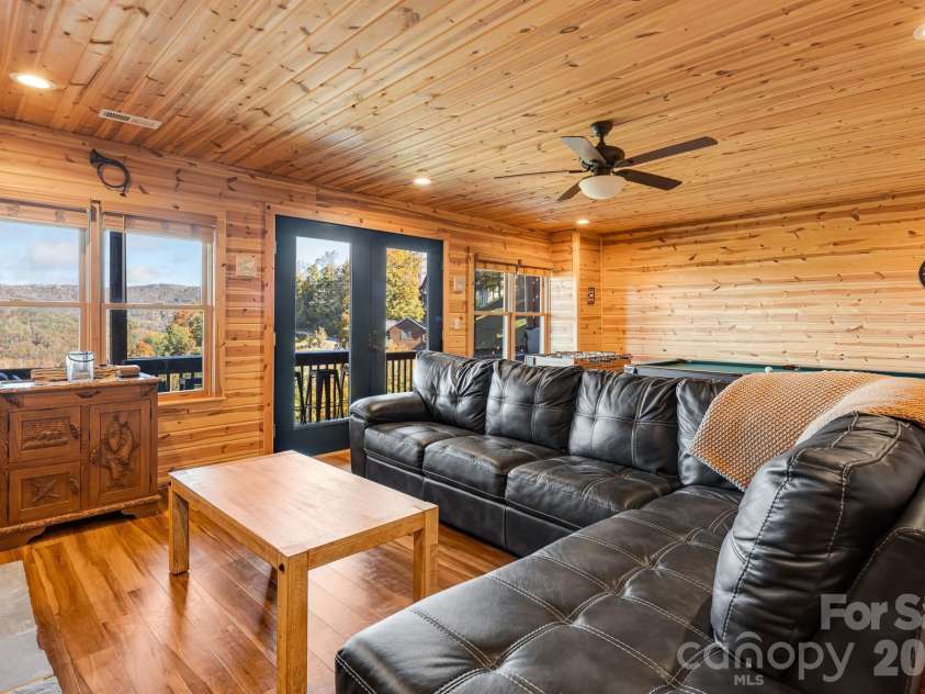 121 Scenic Wolf Drive, Mars Hill, NC 28754.  MLS# CAR4372121, YatesRealty ID 22080. Lower level living room