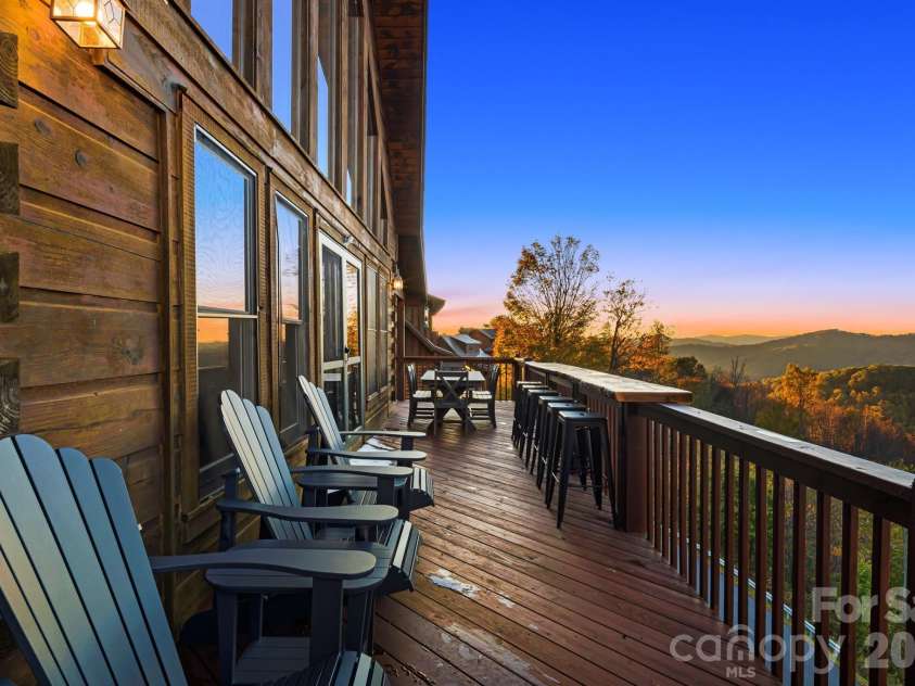 121 Scenic Wolf Drive, Mars Hill, NC 28754.  MLS# CAR4372121, YatesRealty ID 22080. Main level deck w/ amazing views