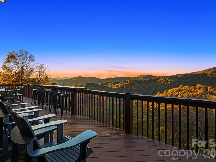 121 Scenic Wolf Drive, Mars Hill, NC 28754.  MLS# CAR4372121, YatesRealty ID 22080. Main level deck w/ amazing views