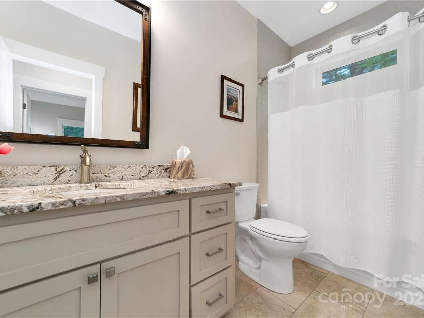 321 Middle Connestee Trail, Brevard, NC 28712.  MLS# CAR4271627, YatesRealty ID 22085. Secondary bathroom
