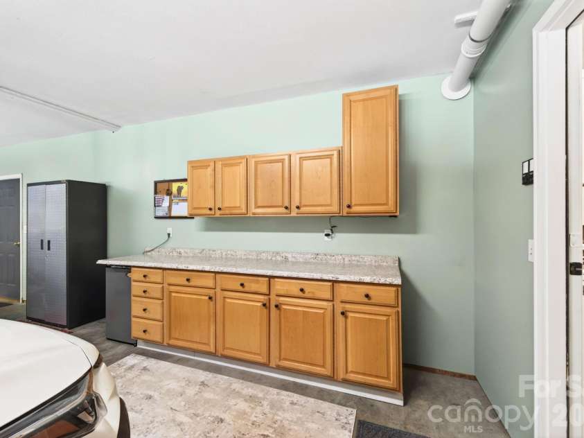 29 Blueberry Lane, Fairview, NC 28730.  MLS# CAR4374304, YatesRealty ID 22087. Built-in garage cabinetry