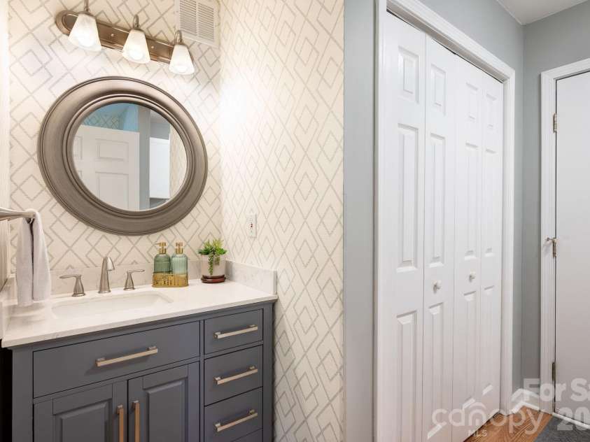 29 Blueberry Lane, Fairview, NC 28730.  MLS# CAR4374304, YatesRealty ID 22087. Main level half-bath has beautiful updates