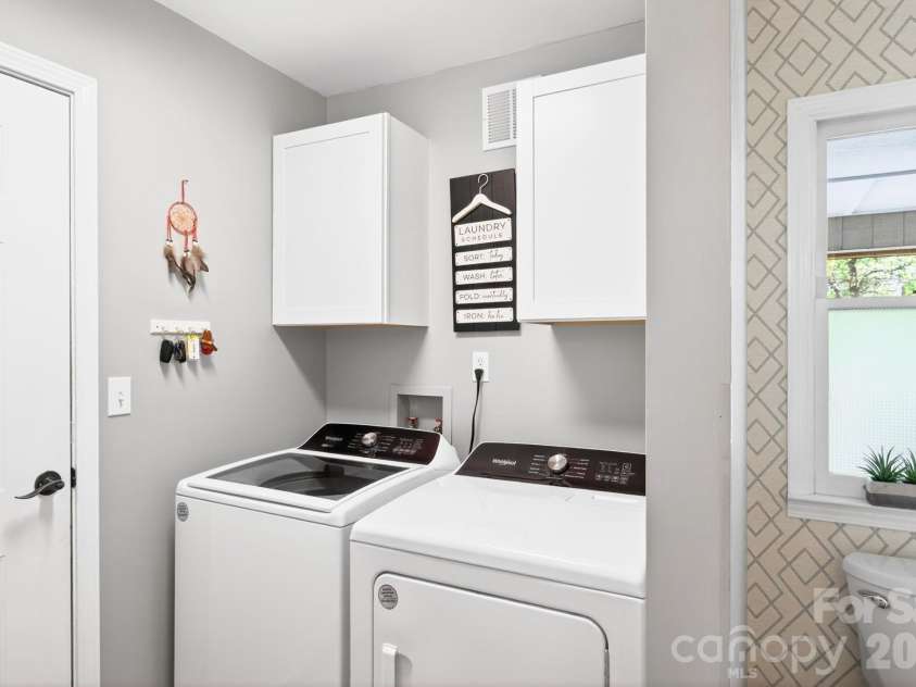 29 Blueberry Lane, Fairview, NC 28730.  MLS# CAR4374304, YatesRealty ID 22087. Main level laundry room off garage