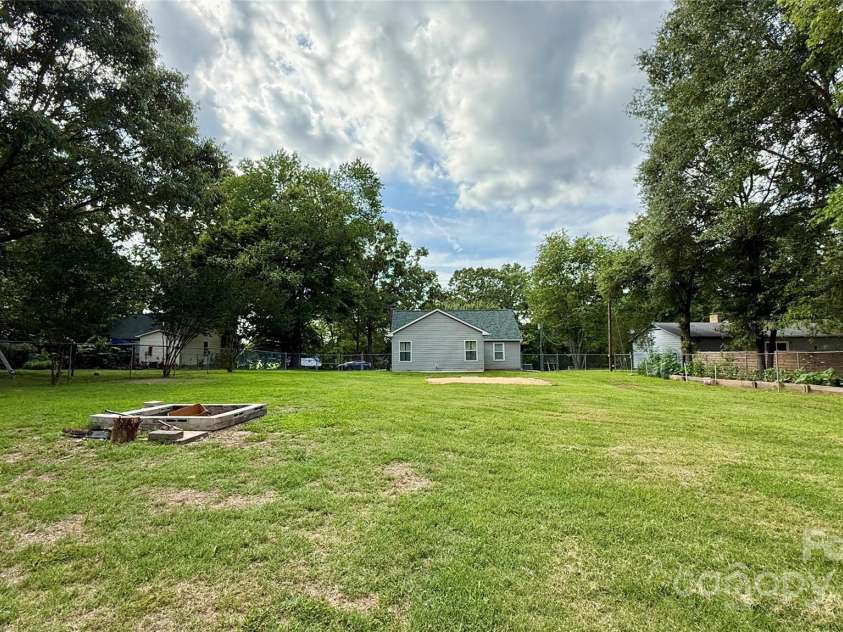 1057 Bethlehem Church Road, Grover, NC 28073.  MLS# CAR4269483, YatesRealty ID 22089. Rear of house from the yard.