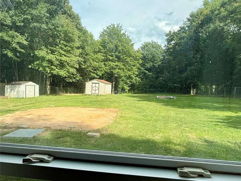 1057 Bethlehem Church Road, Grover, NC 28073.  MLS# CAR4269483, YatesRealty ID 22089. View outside from rear BR