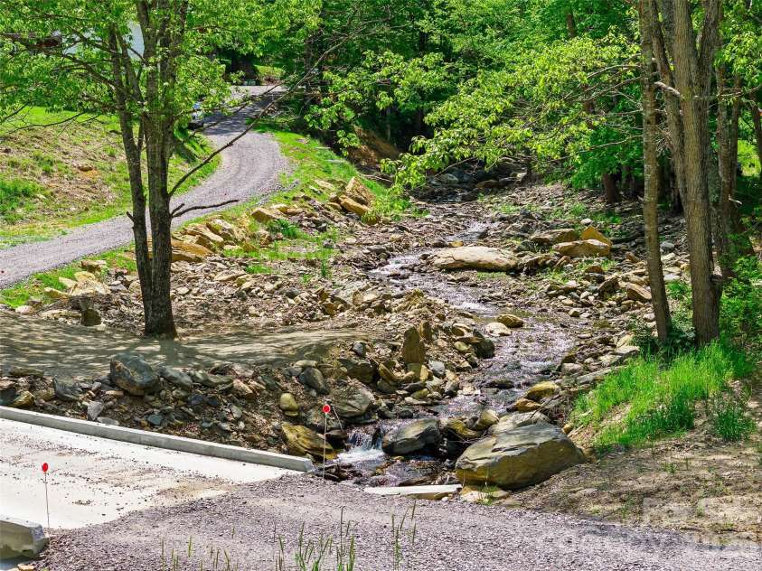115 Sutton Ridge Road, Burnsville, NC 28714.  MLS# CAR4376173, YatesRealty ID 22099. Bolens Creek on the property