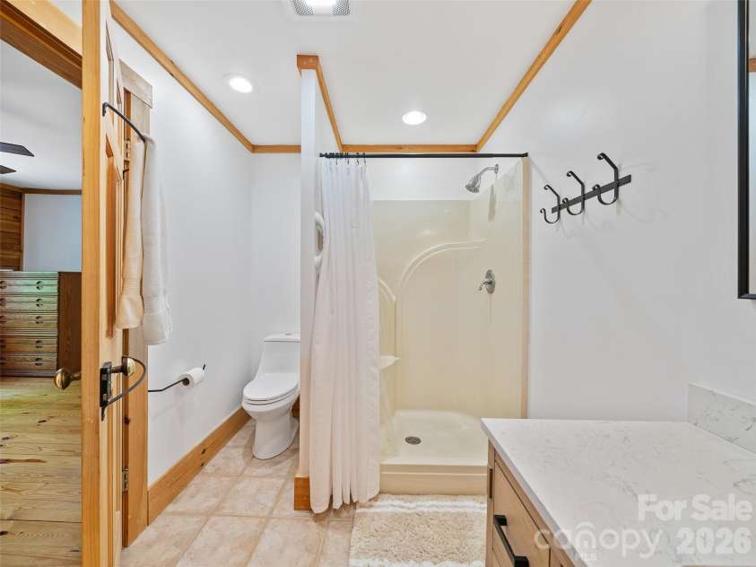 115 Sutton Ridge Road, Burnsville, NC 28714.  MLS# CAR4376173, YatesRealty ID 22099. Ensuite Primary Bathroom