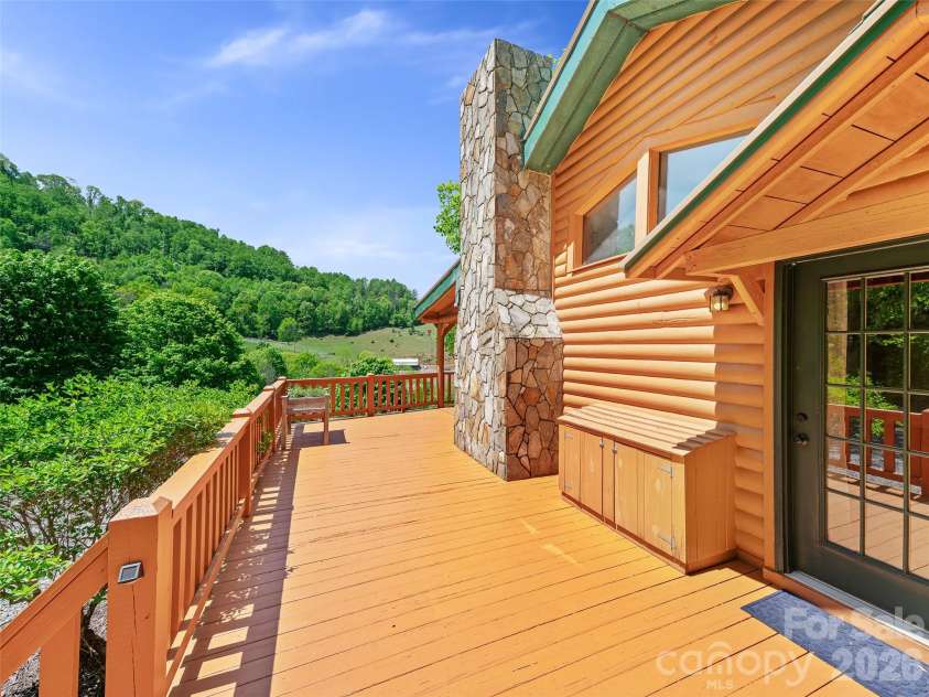 115 Sutton Ridge Road, Burnsville, NC 28714.  MLS# CAR4376173, YatesRealty ID 22099. Wraparound Porch