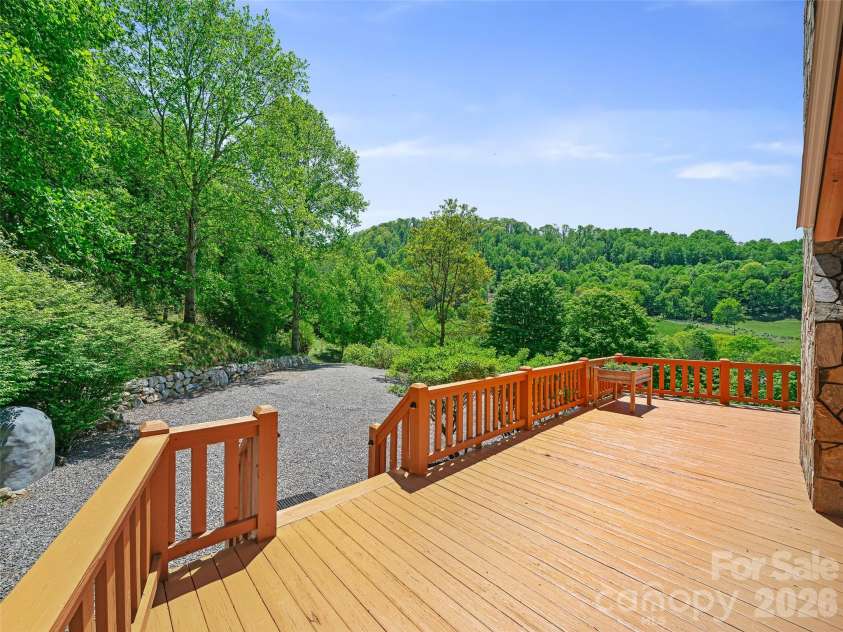 115 Sutton Ridge Road, Burnsville, NC 28714.  MLS# CAR4376173, YatesRealty ID 22099. Wraparound porch and Driveway