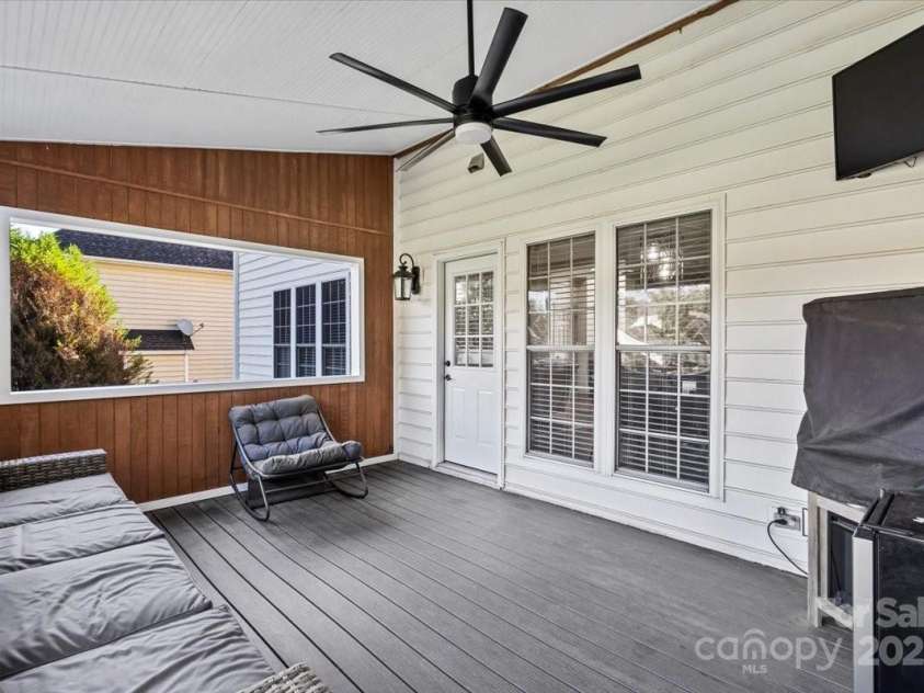 11809 Farnborough Road, Huntersville, NC 28078.  MLS# CAR4315816, YatesRealty ID 2210. Screened porch with TV