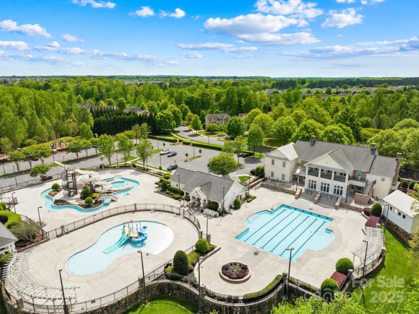 3022 Oakmere Road, Waxhaw, NC 28173.  MLS# CAR4249075, YatesRealty ID 22108. Inside the clubhouse, enjoy elegant lounge areas, a fireplace, cozy seating and a coffee bar—perfect for community events or private rentals. Plus a state-of-the-art movie theater, fitness center and a covered basketball co
