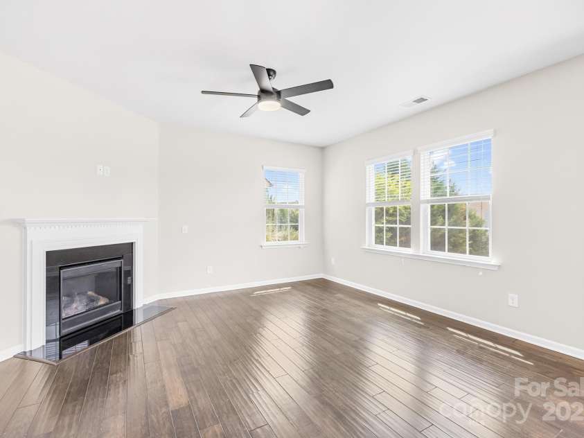 3022 Oakmere Road, Waxhaw, NC 28173.  MLS# CAR4249075, YatesRealty ID 22108. This beautifully designed living space features neutral tones and a cozy gas fireplace—perfect for relaxing or entertaining.