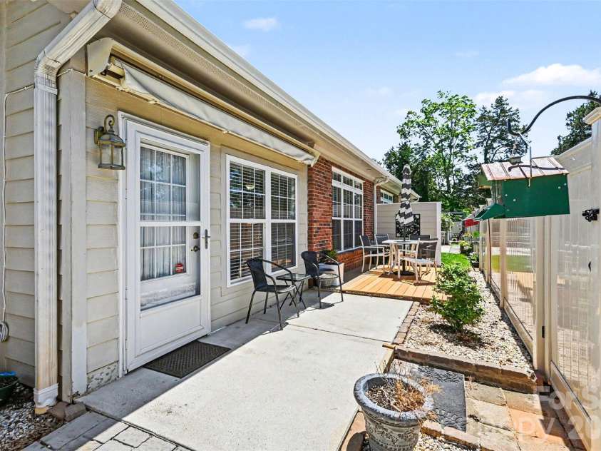 908 Davie Avenue, Statesville, NC 28677.  MLS# CAR4377914, YatesRealty ID 22108. Back Patio with Raised Deck 