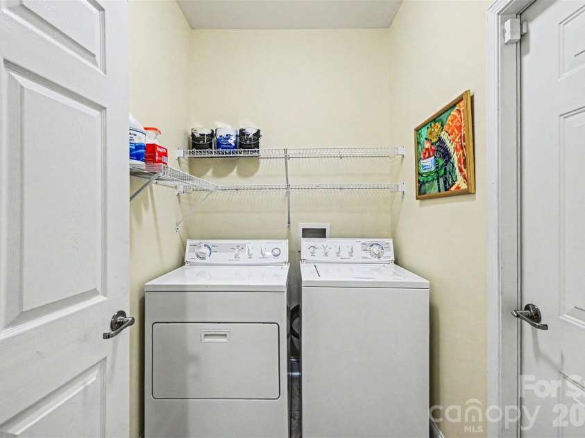 908 Davie Avenue, Statesville, NC 28677.  MLS# CAR4377914, YatesRealty ID 22108. Laundry with Storage Shelving 