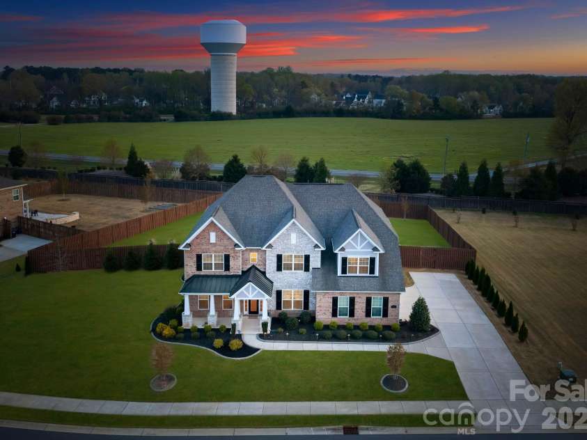 1053 Harlow's Crossing Drive, Matthews, NC 28104.  MLS# CAR4353232, YatesRealty ID 22111. Aerial view showcasing large lot and private setting