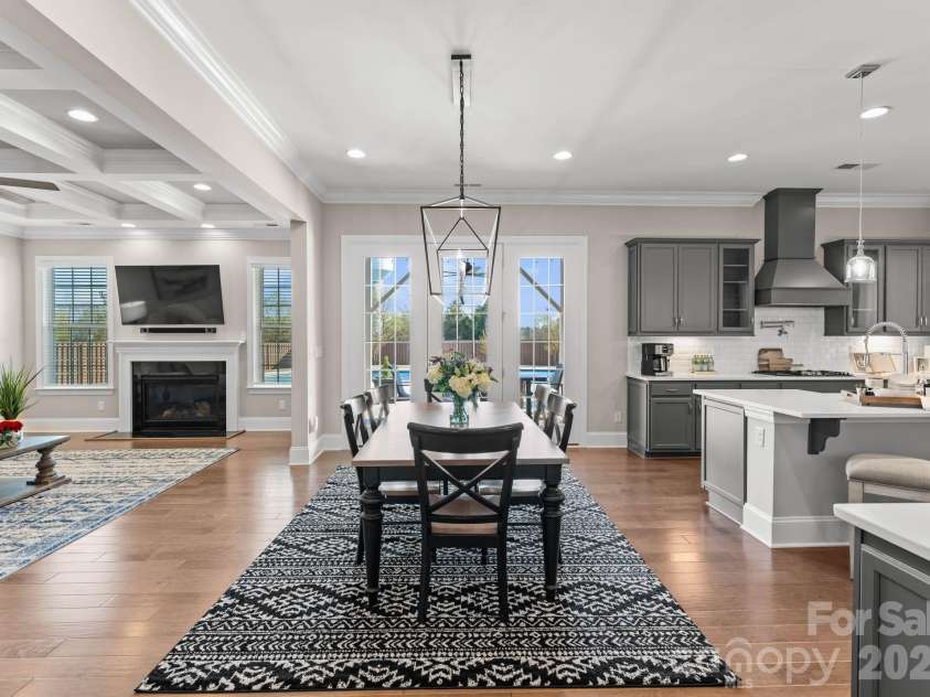 1053 Harlow's Crossing Drive, Matthews, NC 28104.  MLS# CAR4353232, YatesRealty ID 22111. Dining area overlooking living space and backyard