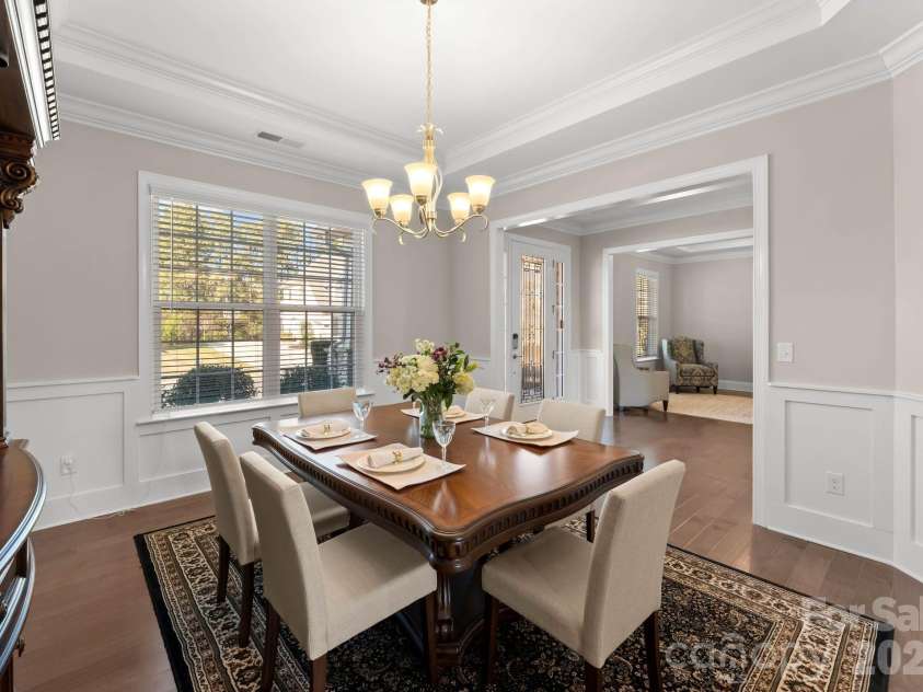 1053 Harlow's Crossing Drive, Matthews, NC 28104.  MLS# CAR4353232, YatesRealty ID 22111. Formal dining room with classic finishes