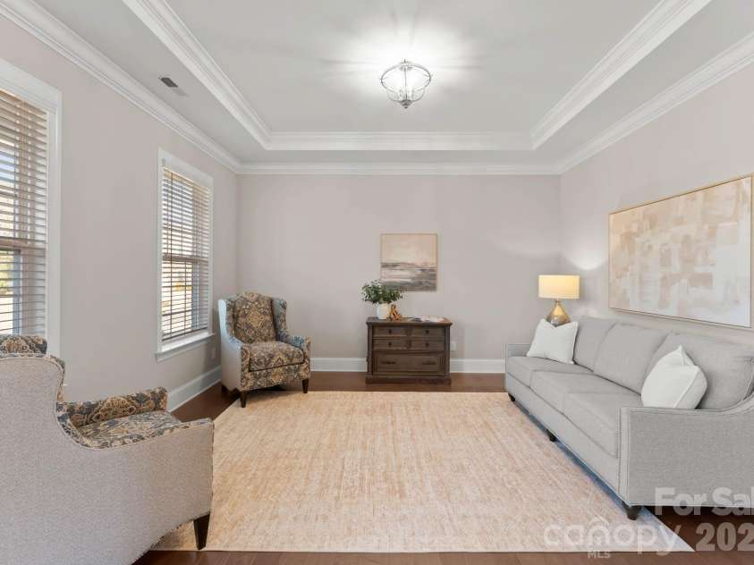 1053 Harlow's Crossing Drive, Matthews, NC 28104.  MLS# CAR4353232, YatesRealty ID 22111. Formal sitting room with windows and natural light
