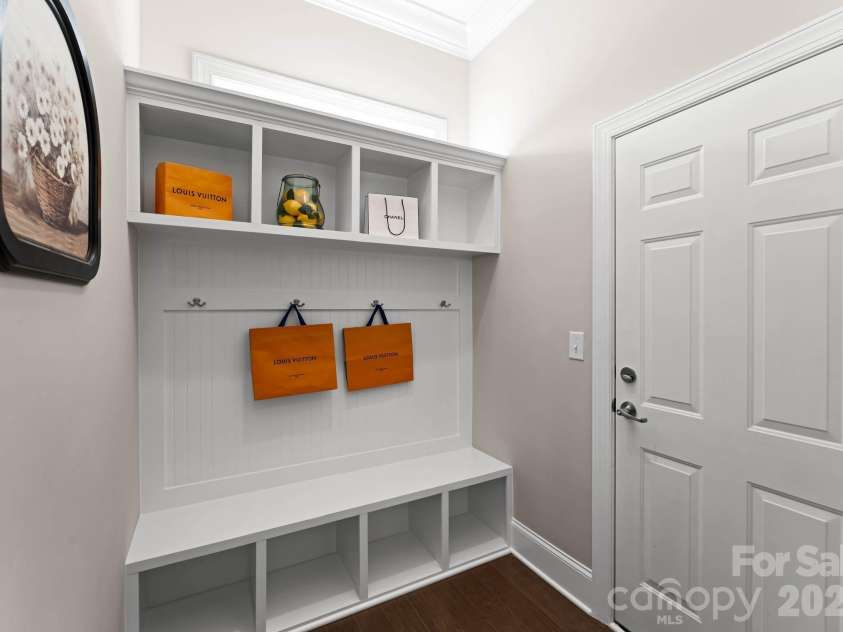 1053 Harlow's Crossing Drive, Matthews, NC 28104.  MLS# CAR4353232, YatesRealty ID 22111. Functional mudroom with built-in storage and drop zone