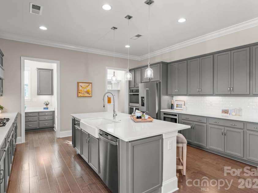 1053 Harlow's Crossing Drive, Matthews, NC 28104.  MLS# CAR4353232, YatesRealty ID 22111. Kitchen with extensive counter space and storage