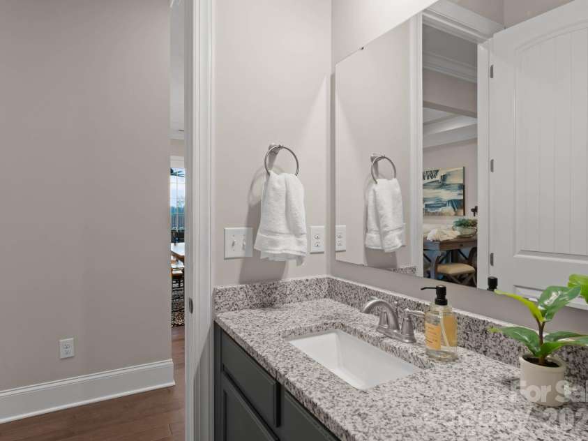 1053 Harlow's Crossing Drive, Matthews, NC 28104.  MLS# CAR4353232, YatesRealty ID 22111. Main level half bathroom