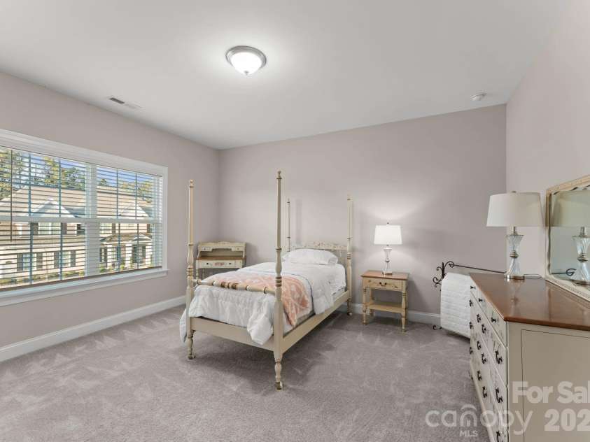 1053 Harlow's Crossing Drive, Matthews, NC 28104.  MLS# CAR4353232, YatesRealty ID 22111. Secondary bedroom with natural light and spacious layout