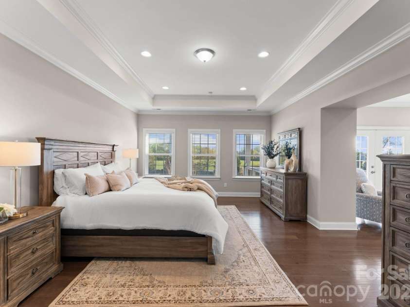 1053 Harlow's Crossing Drive, Matthews, NC 28104.  MLS# CAR4353232, YatesRealty ID 22111. Spacious primary bedroom with tray ceiling