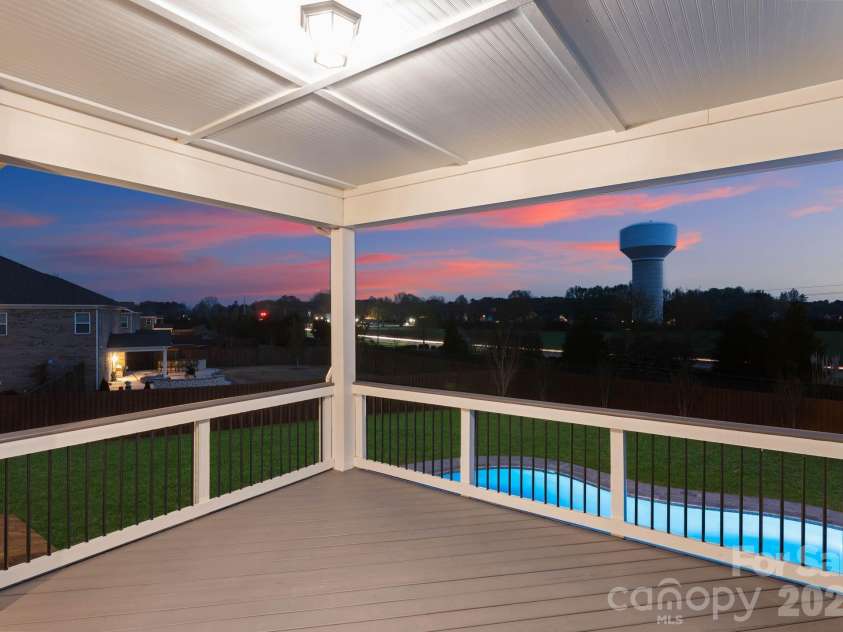 1053 Harlow's Crossing Drive, Matthews, NC 28104.  MLS# CAR4353232, YatesRealty ID 22111. Upper balcony with scenic sunset views