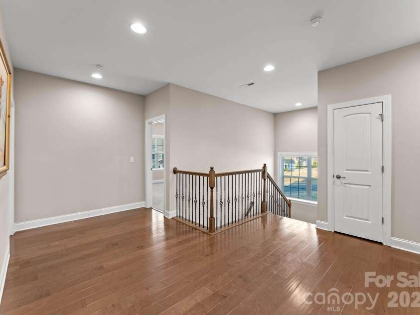 1053 Harlow's Crossing Drive, Matthews, NC 28104.  MLS# CAR4353232, YatesRealty ID 22111. Upper-level hallway