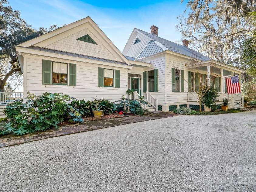 131 Pritchard Street, Bluffton, SC 29910.  MLS# CAR4214365, YatesRealty ID 2212. Galvanized metal roof, wood siding, several porches and shutters