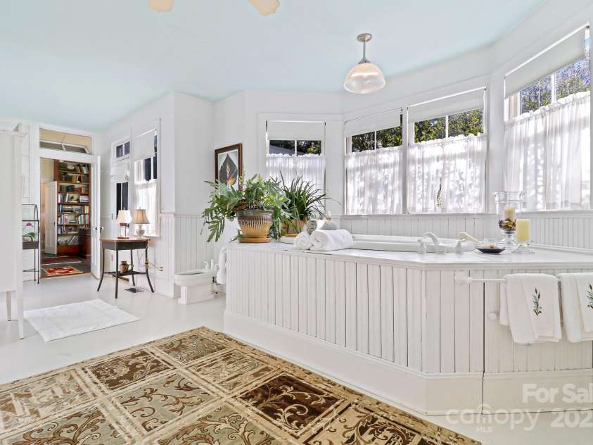 131 Pritchard Street, Bluffton, SC 29910.  MLS# CAR4214365, YatesRealty ID 2212. Large tub beneath wall of windows, separate shower, dual vanity and private porch
