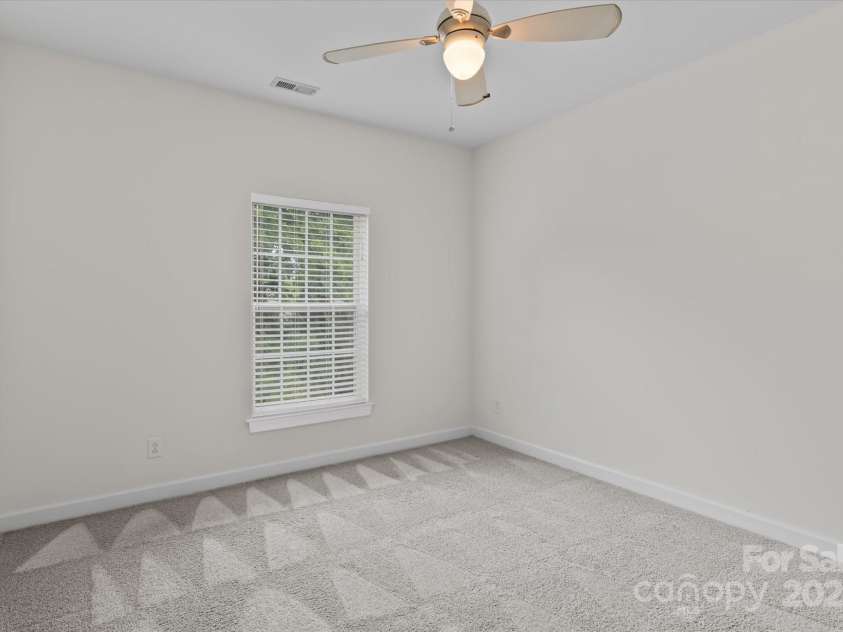 1530 Church Street, Charlotte, NC 28203.  MLS# CAR4259116, YatesRealty ID 22130. Bedroom 2 with plush carpeting and ceiling fan with light