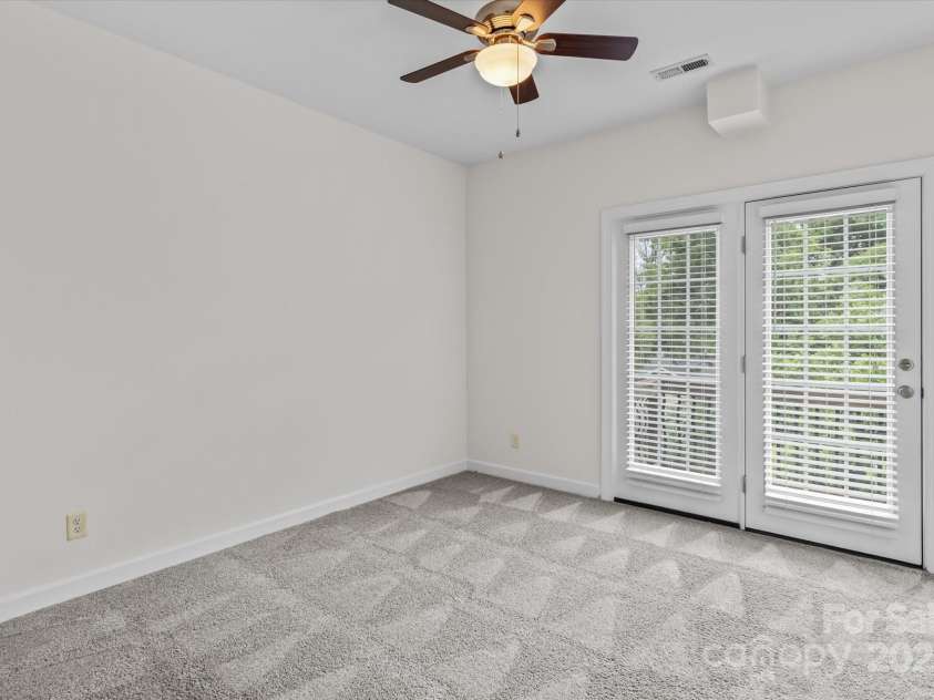 1530 Church Street, Charlotte, NC 28203.  MLS# CAR4259116, YatesRealty ID 22130. Bedroom 3 with plush carpeting and ceiling fan and light