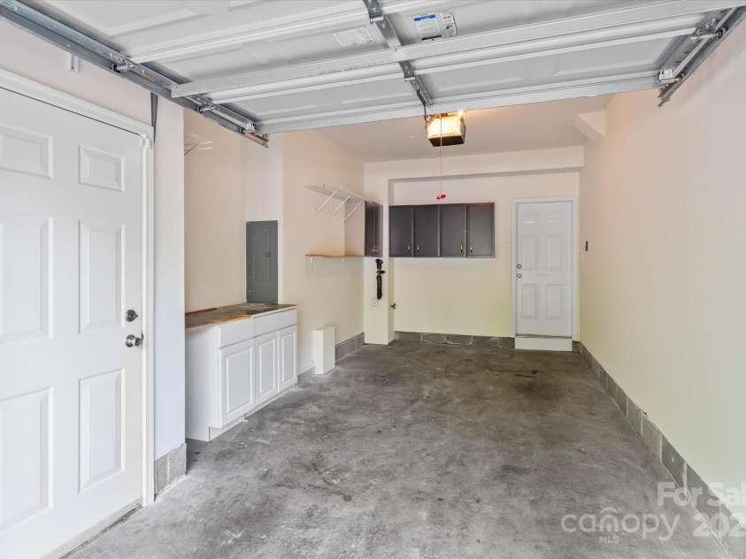 1530 Church Street, Charlotte, NC 28203.  MLS# CAR4259116, YatesRealty ID 22130. One car garage with cabinets for extra storage.