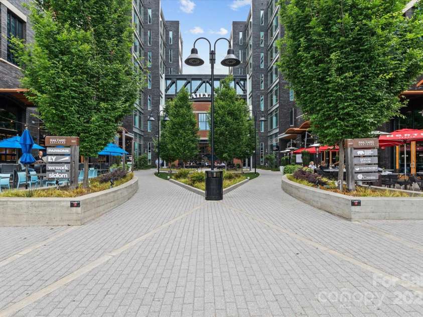 1530 Church Street, Charlotte, NC 28203.  MLS# CAR4259116, YatesRealty ID 22130. The Rail Yard is a fun gathering spot with seating areas, restaurants, shops and offices