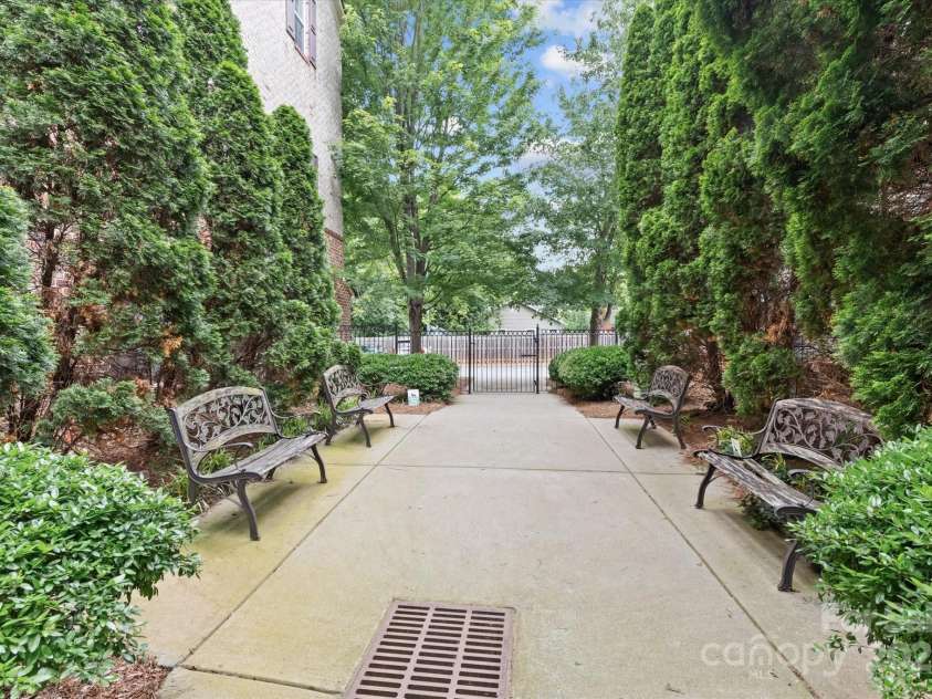 1530 Church Street, Charlotte, NC 28203.  MLS# CAR4259116, YatesRealty ID 22130. This charming courtyard with seating takes you directly to your garage and additional parking space.