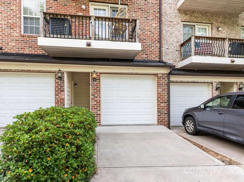 1530 Church Street, Charlotte, NC 28203.  MLS# CAR4259116, YatesRealty ID 22130. View of your attached oversized one car garage and balcony with room for seating or a table and chairs.